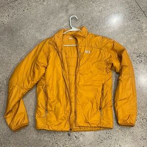 REI puffer jacket in mustard